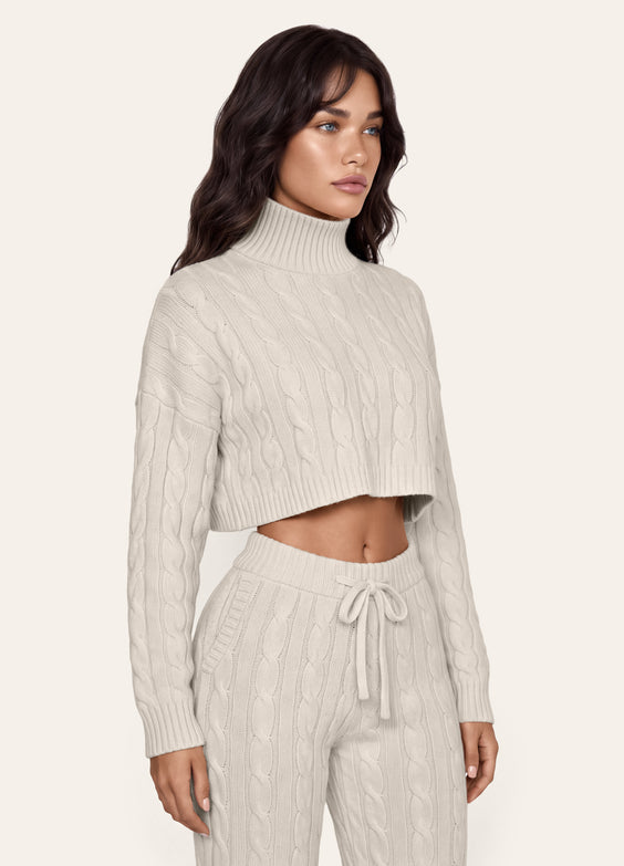 Maglione corto a trecce