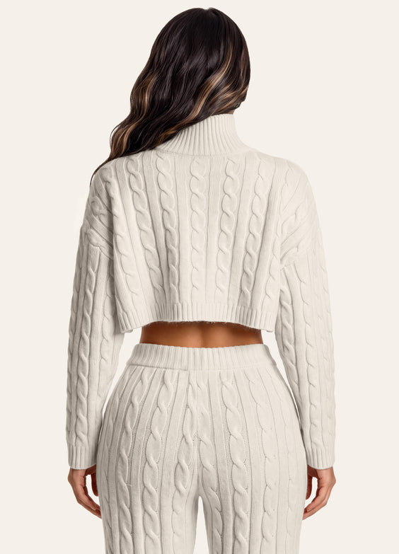 Maglione corto a trecce